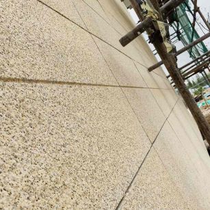 乌兰察布 黄金麻花岗岩荔枝面外墙干挂石材效果示例